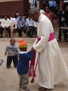 IS the Archbishop a magnet for the children, or the children a magnet for the Archbishop??